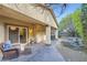 Back patio features a covered area with outdoor seating and access to a serene backyard at 11165 Robin Park Ave, Las Vegas, NV 89138