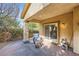 Enjoy outdoor living on this covered patio with stone pillars and access to the backyard at 11165 Robin Park Ave, Las Vegas, NV 89138