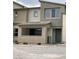 Inviting two-story home featuring a covered porch, neutral color palette, and modern architectural details at 11394 Ethereal Landing Ave, Las Vegas, NV 89138