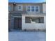 Two-story home featuring a stone facade, a covered entryway, and neutral color palette at 11414 Ethereal Landing Ave, Las Vegas, NV 89138