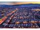 Panoramic aerial night view of a neatly planned community highlighting street lights and mountain views at 11831 Saverio Ave, Las Vegas, NV 89138