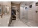 Spacious bathroom with double sink vanity and glass shower with tile surround at 11831 Saverio Ave, Las Vegas, NV 89138