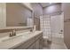 This bathroom features double sinks, a large mirror, and a shower and tub combo at 11831 Saverio Ave, Las Vegas, NV 89138