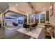 Bright dining room with modern chandelier and sliding doors to covered patio at 11831 Saverio Ave, Las Vegas, NV 89138