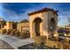 Estrella neighborhood entrance with stone archway and desert landscaping at 11831 Saverio Ave, Las Vegas, NV 89138