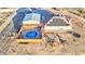 Aerial view of a desert home featuring a swimming pool and deck, storage barn and play structure at 1464 Barlow Ave, Moapa, NV 89025