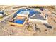 Expansive desert property featuring a pool with deck, barn, playset and house with solar panels at 1464 Barlow Ave, Moapa, NV 89025