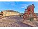 Backyard with play structure and views at 1464 Barlow Ave, Moapa, NV 89025