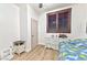 Bedroom with a wooden-look floor, dresser and a built-in headboard at 1464 Barlow Ave, Moapa, NV 89025