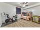 Cozy bedroom featuring a bunk bed, wood-look flooring, and a modern ceiling fan at 1464 Barlow Ave, Moapa, NV 89025