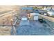 Aerial view of a ranch style home with garage and wide driveway at 1464 Barlow Ave, Moapa, NV 89025