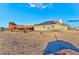 Exterior of home with solar panels, playset, and sand lot at 1464 Barlow Ave, Moapa, NV 89025