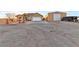 View of the home with a large driveway and a separate storage building at 1464 Barlow Ave, Moapa, NV 89025