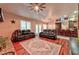 Spacious living room with plush sofas, a decorative rug, and a view into the adjoining kitchen at 1464 Barlow Ave, Moapa, NV 89025