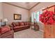 Cozy living room featuring comfortable seating and natural light from plantation shutters at 1464 Barlow Ave, Moapa, NV 89025