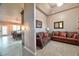 Inviting living room with wood-look tile flooring and access to the dining room at 1464 Barlow Ave, Moapa, NV 89025