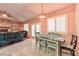 A bright living room and dining area with an adjacent view into the comfortable living room at 1464 Barlow Ave, Moapa, NV 89025