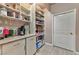 Organized pantry with ample shelving and storage space, adjacent to a beverage station with countertop at 1464 Barlow Ave, Moapa, NV 89025