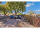 Backyard with brick patio, landscaping, table with chairs at 1564 Fieldbrook St, Henderson, NV 89052