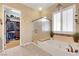 Bright bathroom showcasing a soaking tub with a glass shower, vanity, and convenient access to a walk-in closet at 1564 Fieldbrook St, Henderson, NV 89052