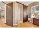 Bedroom showcasing an interior hallway view, featuring a barn-style door and complemented by hardwood floors at 1564 Fieldbrook St, Henderson, NV 89052