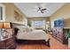 Bedroom showcasing hardwood floors, a ceiling fan, natural lighting, and elegant décor at 1564 Fieldbrook St, Henderson, NV 89052