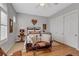 Charming bedroom featuring a decorative bed frame, ceiling fan, and a view of the window with white shutters at 1564 Fieldbrook St, Henderson, NV 89052