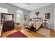 Inviting bedroom with hardwood floors, ceiling fan, and plenty of natural light at 1564 Fieldbrook St, Henderson, NV 89052