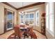 Cozy breakfast nook offers ample sunlight with large windows and a charming chandelier at 1564 Fieldbrook St, Henderson, NV 89052