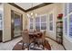 Charming breakfast nook with a round table and a large window for natural light at 1564 Fieldbrook St, Henderson, NV 89052