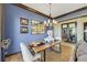 Contemporary dining area featuring hardwood floors and lots of light from a large window at 1564 Fieldbrook St, Henderson, NV 89052