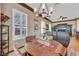 Bright dining room features modern chandelier and ample seating for entertaining guests at 1564 Fieldbrook St, Henderson, NV 89052