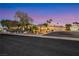 Exterior shot shows front yard with driveway leading to property, and lush landscaping at 1564 Fieldbrook St, Henderson, NV 89052