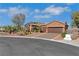 Beautiful home with desert landscaping, mature trees, and a two car garage at 1564 Fieldbrook St, Henderson, NV 89052