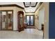 Inviting foyer showcasing neutral walls, tile floors, and views of the entry with decorative glass doors at 1564 Fieldbrook St, Henderson, NV 89052