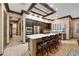 Beautiful kitchen with a center island, barstool seating, and ample cabinet space with seamless access to other living spaces at 1564 Fieldbrook St, Henderson, NV 89052