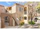 Charming multi-level home with stucco exterior, private balcony, and well-maintained landscaping at 1851 Hillpointe Rd # 2922, Henderson, NV 89074