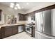 Well-lit kitchen with stainless steel appliances and granite countertops at 1851 Hillpointe Rd # 2922, Henderson, NV 89074