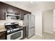 Contemporary kitchen featuring stainless steel appliances and granite countertops at 1851 Hillpointe Rd # 2922, Henderson, NV 89074