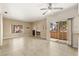 Expansive living room featuring tile flooring, fireplace, sliding doors, and natural light at 1851 Hillpointe Rd # 2922, Henderson, NV 89074