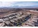 Panoramic aerial view of a planned community nestled against a mountain backdrop, showcasing modern homes and landscaping at 2153 Havensight Ln, Henderson, NV 89052