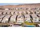 Aerial view of a residential area, highlighting houses with backyard pools in a modern planned community at 2153 Havensight Ln, Henderson, NV 89052