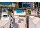 Aerial view of the backyard featuring a sparkling pool, spa, and lush landscaping, creating a private oasis at 2153 Havensight Ln, Henderson, NV 89052