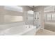 Beautiful bathroom with soaking tub, step-in shower, and tile floors at 2153 Havensight Ln, Henderson, NV 89052