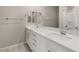 This bathroom boasts dual sinks, white cabinets, and a shower at 2153 Havensight Ln, Henderson, NV 89052