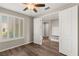 This bedroom features plantation shutters, hardwood floors, a ceiling fan, and ample closet space at 2153 Havensight Ln, Henderson, NV 89052