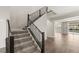 Open foyer with a hardwood floor and black railing at 2153 Havensight Ln, Henderson, NV 89052