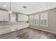 Bright kitchen features white cabinetry, countertops, and multiple shuttered windows at 2153 Havensight Ln, Henderson, NV 89052