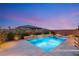 Beautiful backyard view with a custom pool, spa, and desert landscaping at 2153 Havensight Ln, Henderson, NV 89052