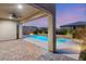 Inviting backyard pool and spa area with a covered patio, perfect for outdoor entertaining and relaxation at 2153 Havensight Ln, Henderson, NV 89052